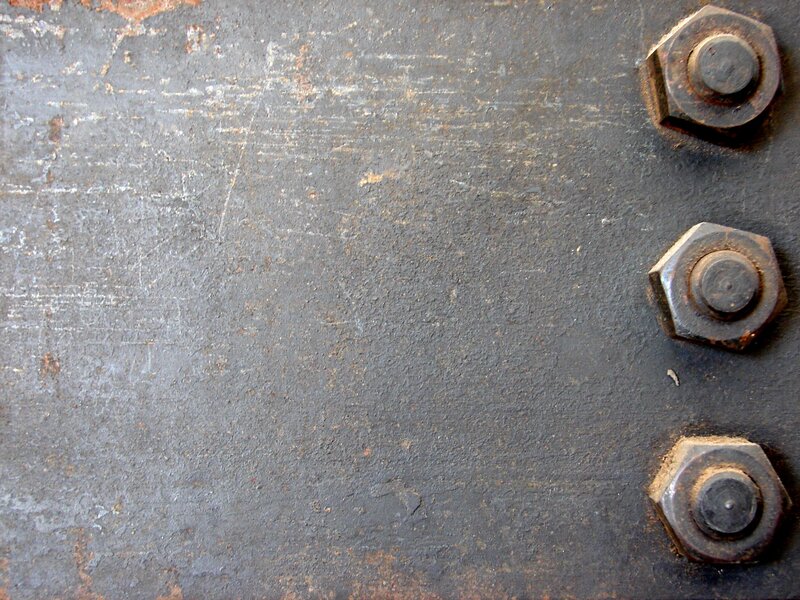 rusty bolts on metal surface