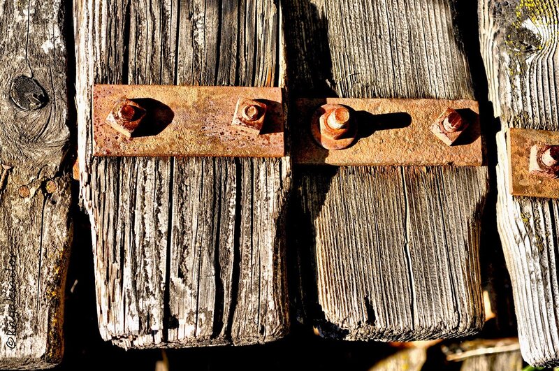 Rusty Bolts on Wood