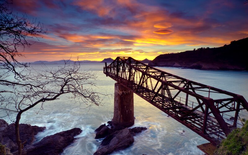 Rusty Bridge at Sunset — Orange