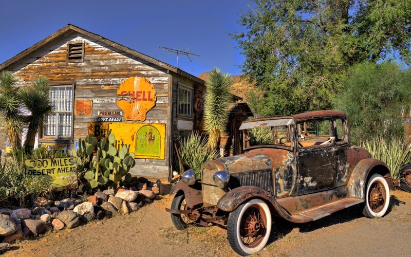 Rusty Car and Old Building — Brown, Desolate