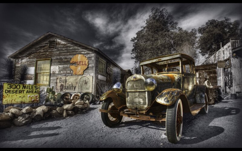 Rusty car at old gas station