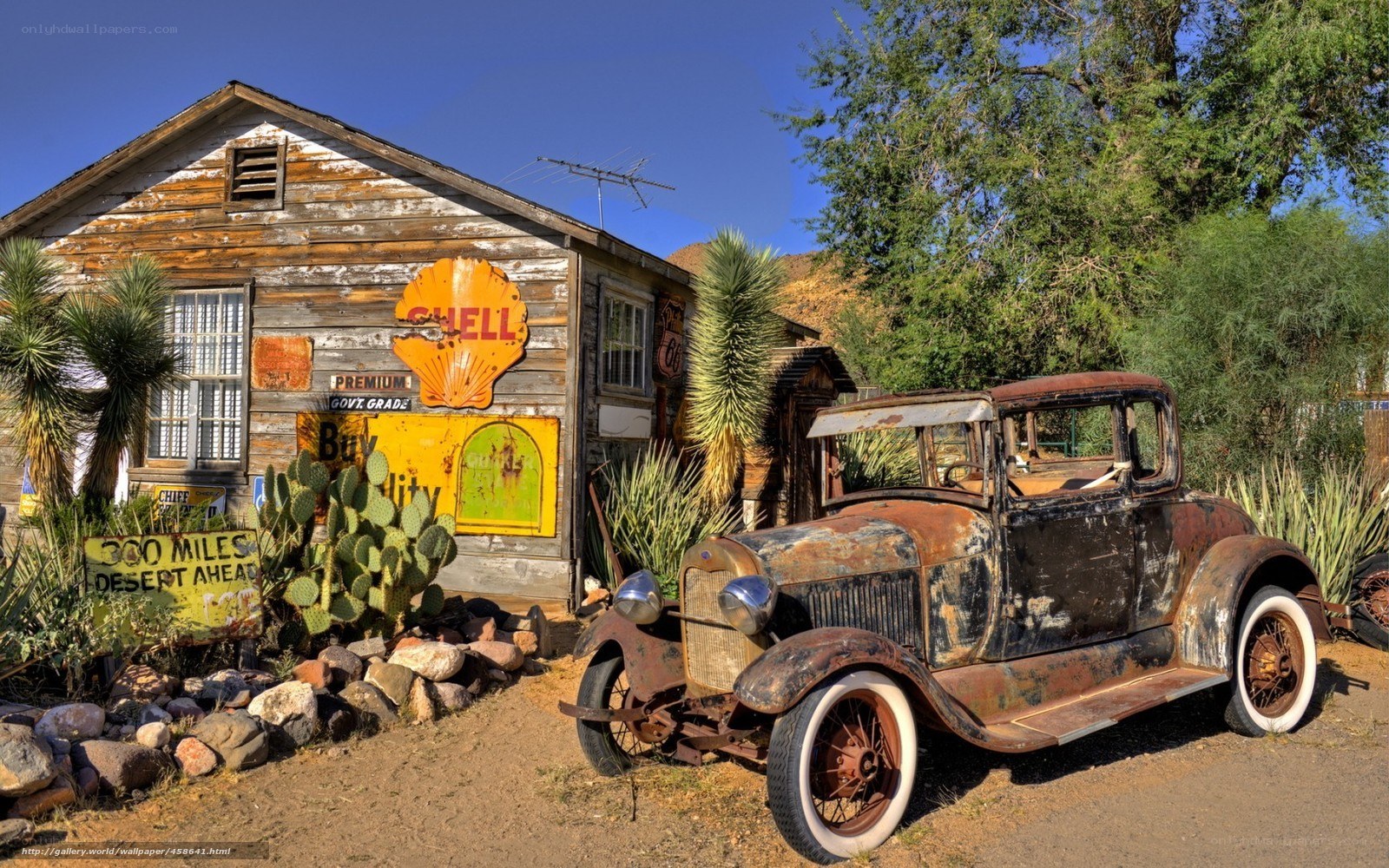 Rusty car at old gas station