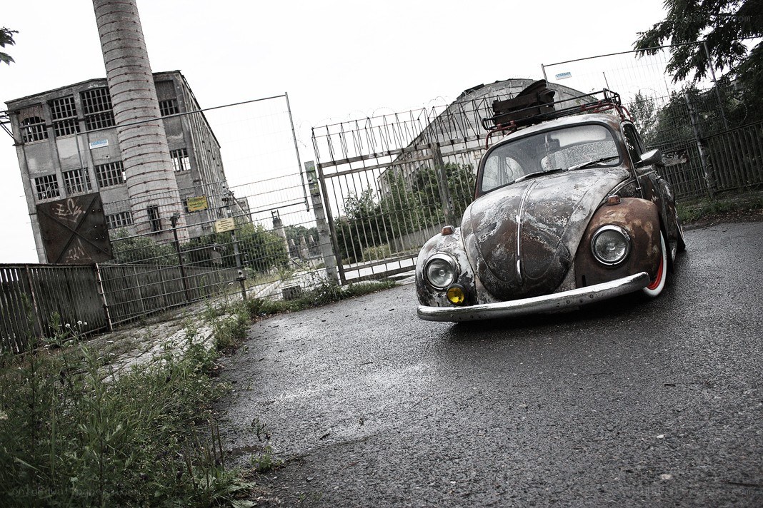 Rusty car in abandoned industrial area