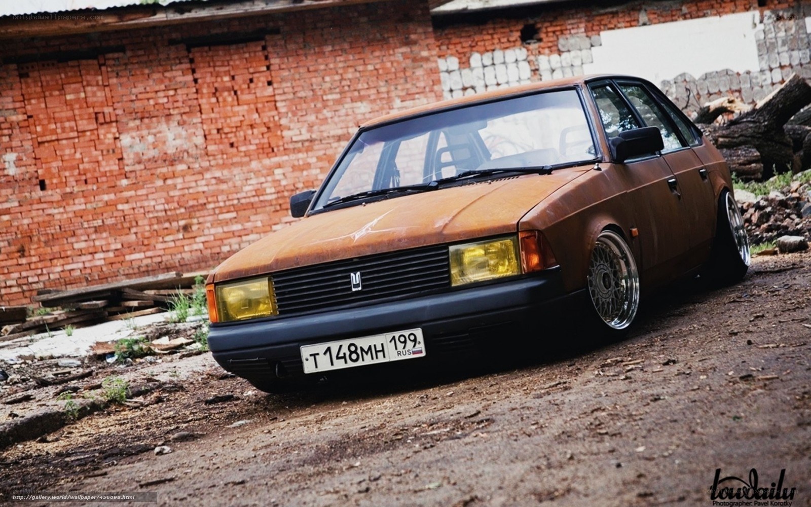 rusty car in alley
