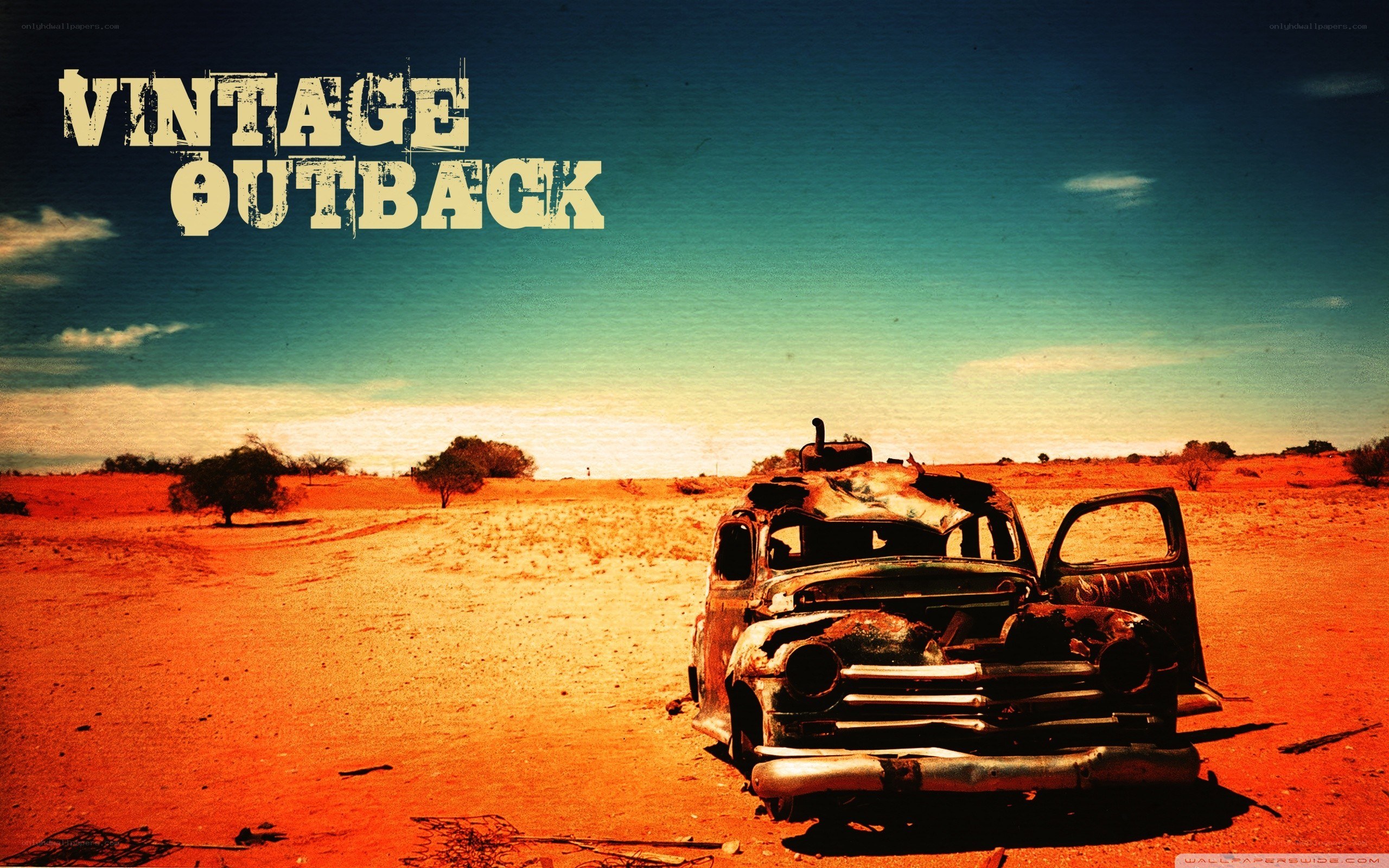 Rusty car in desert