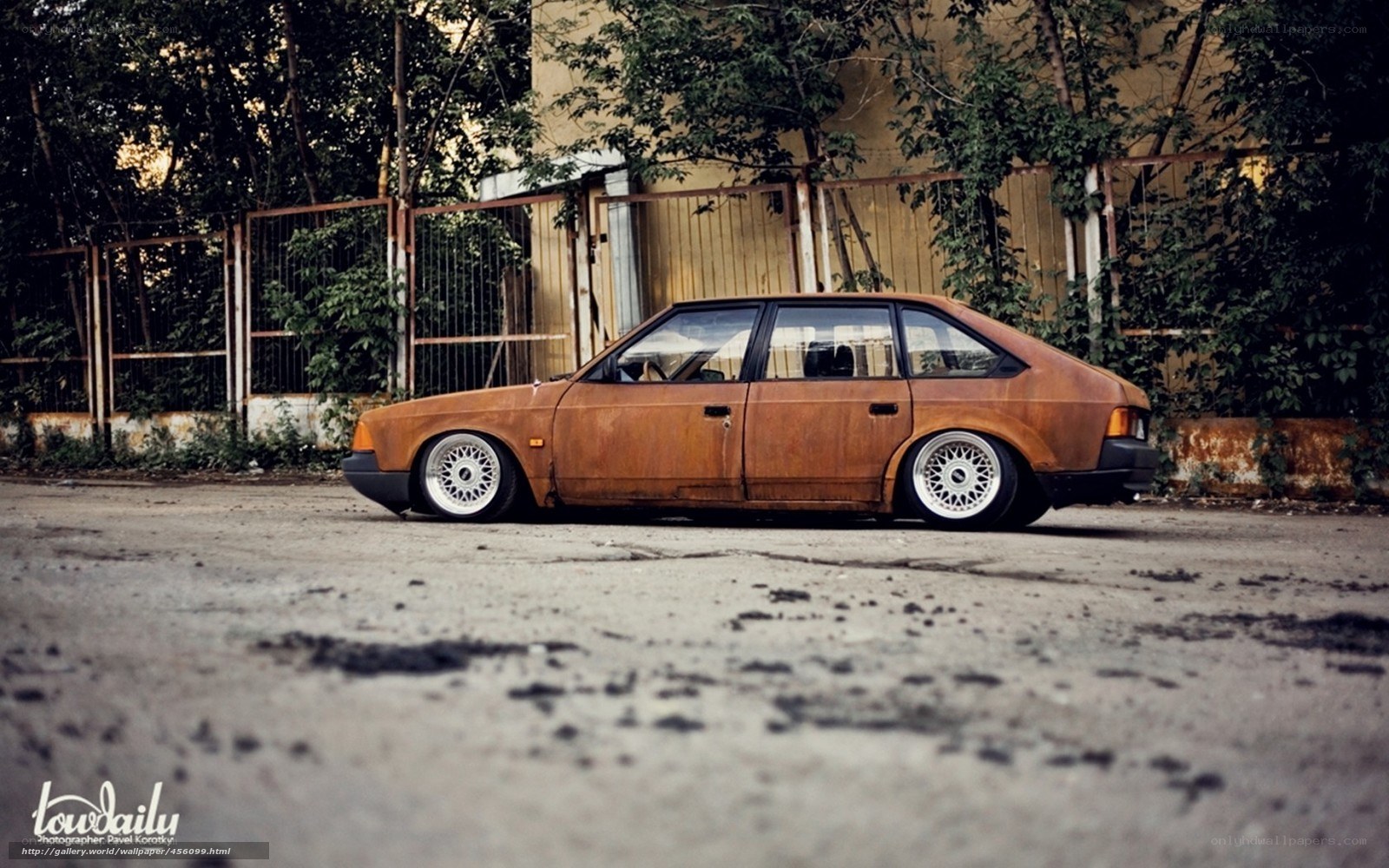 Rusty car in urban setting