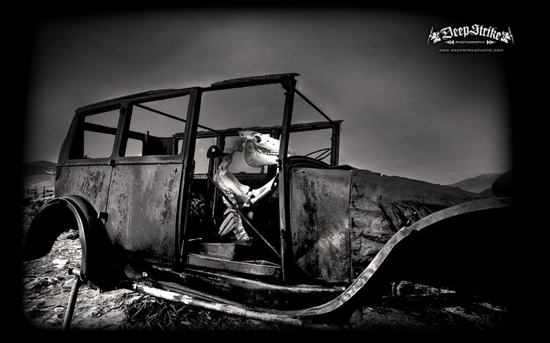 Rusty car with skull inside