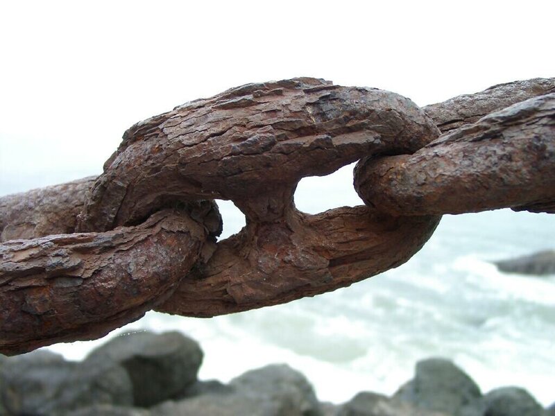 Rusty chain by the sea