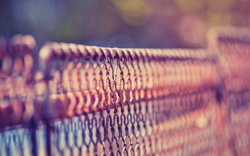 rusty chain-link fence