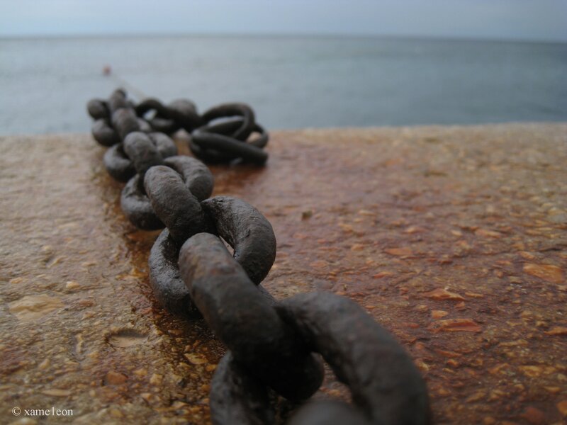 Rusty chain on a pier