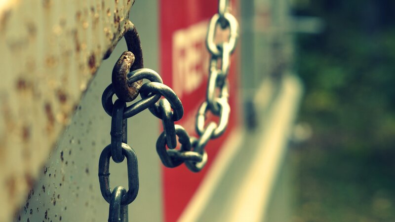 rusty chain on metal surface