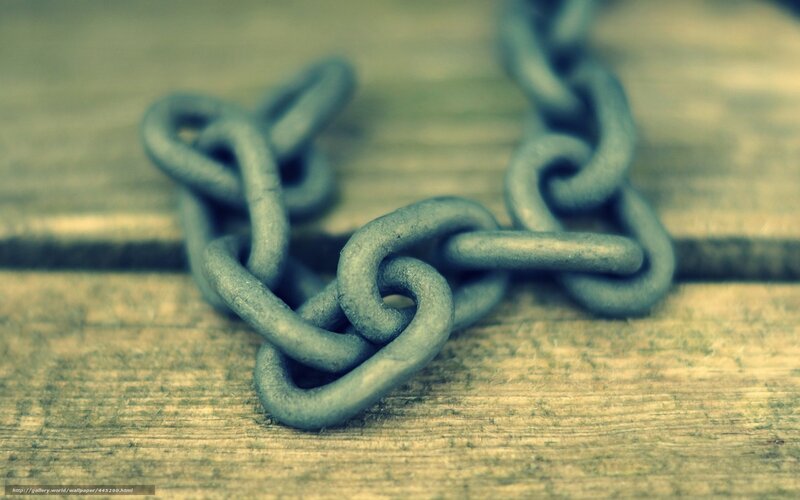 rusty chain on wood