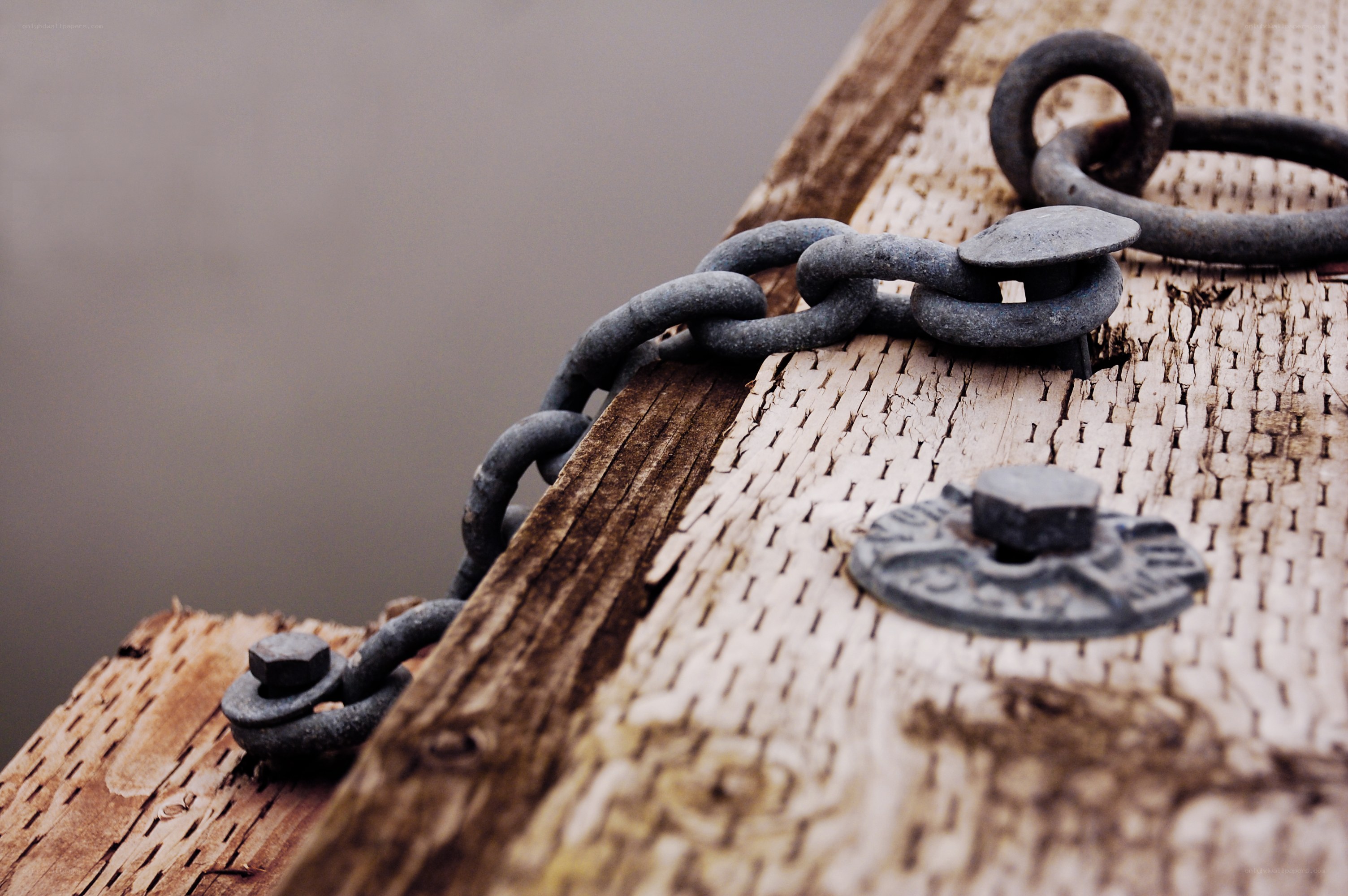 rusty chain on wooden dock