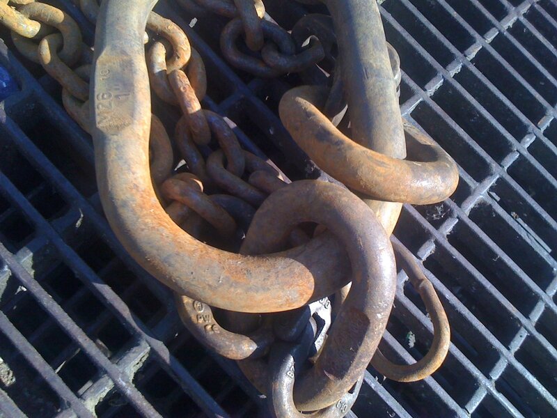 rusty chains on a metal grate