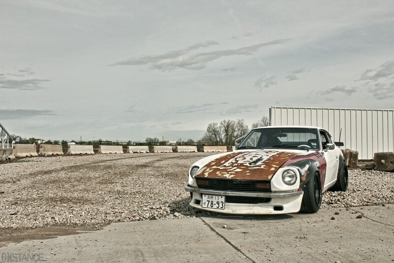 Rusty classic car on gravel