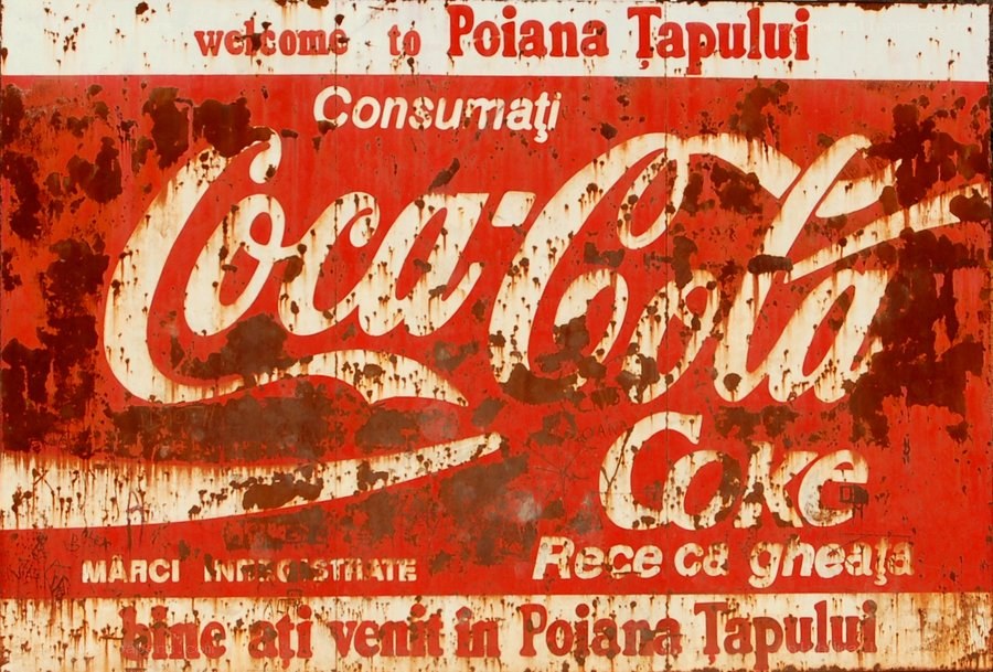 Rusty Coca-Cola sign in Romania