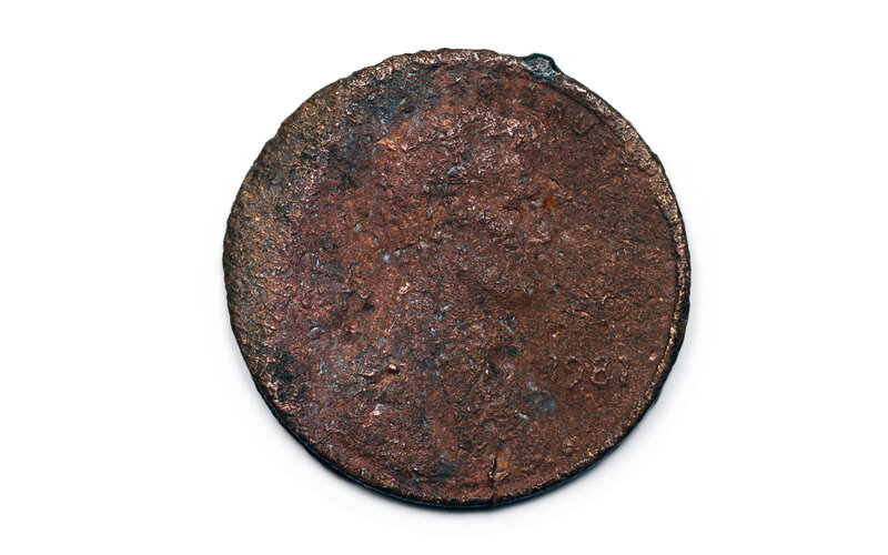 Rusty coin on white background