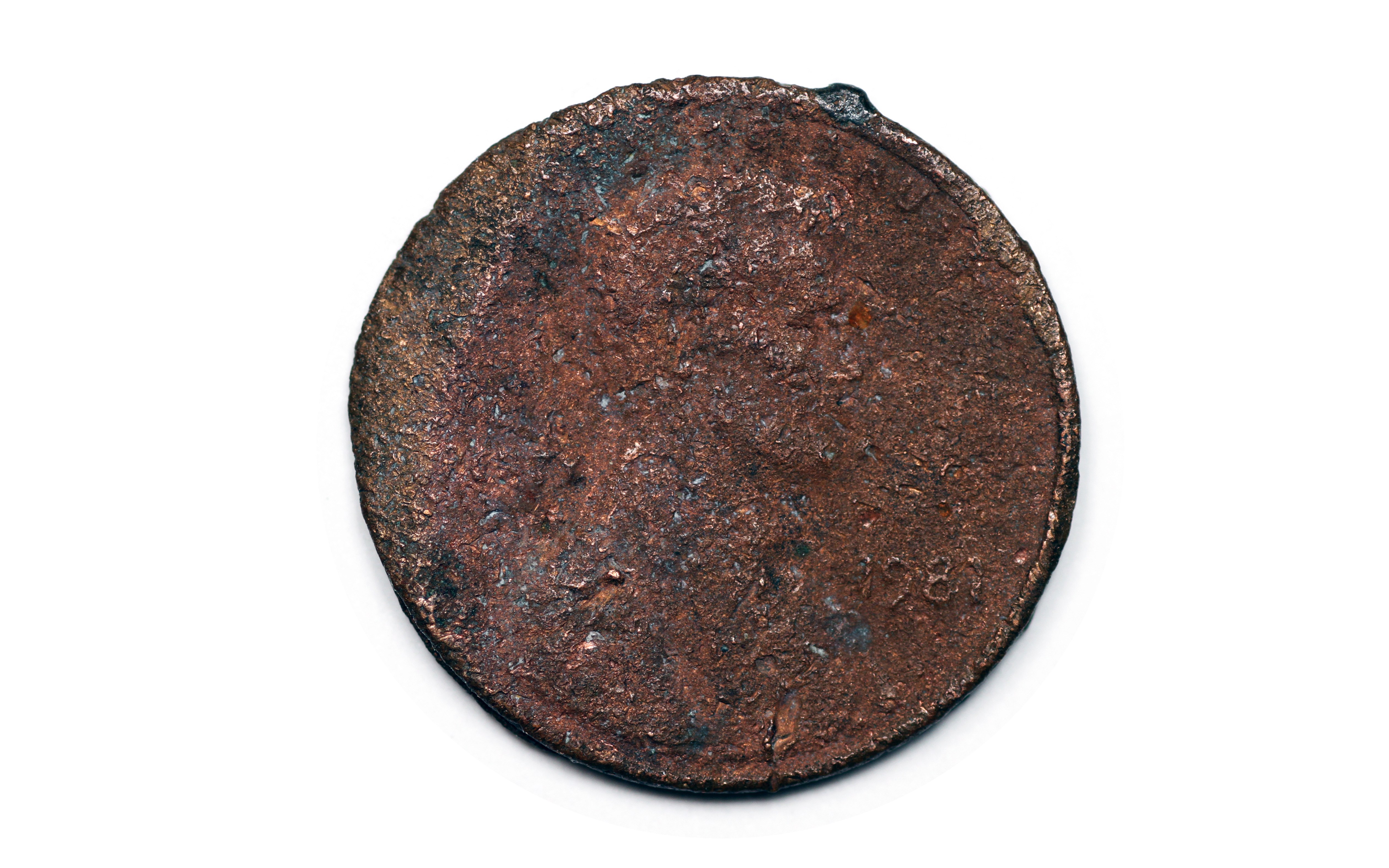 Rusty coin on white background