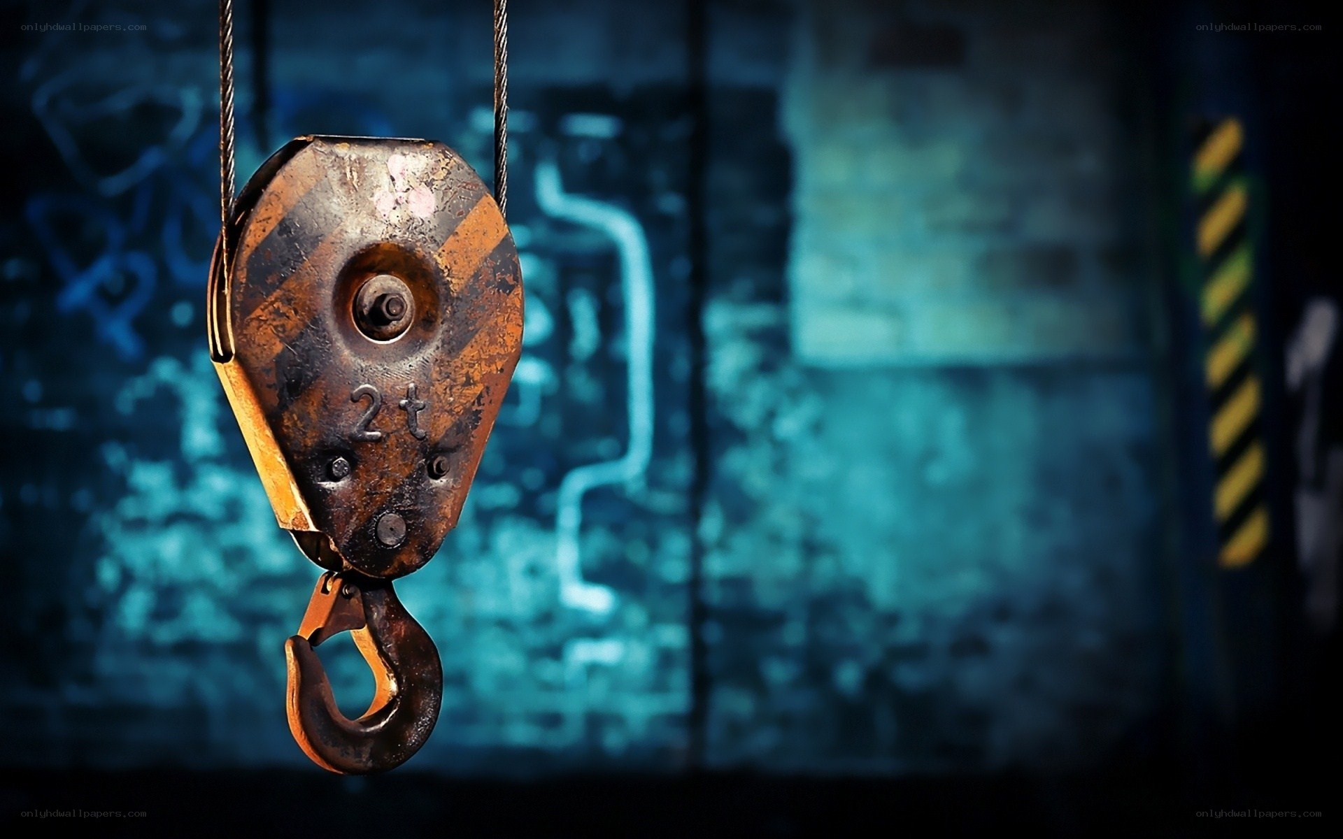 Rusty crane hook in industrial setting
