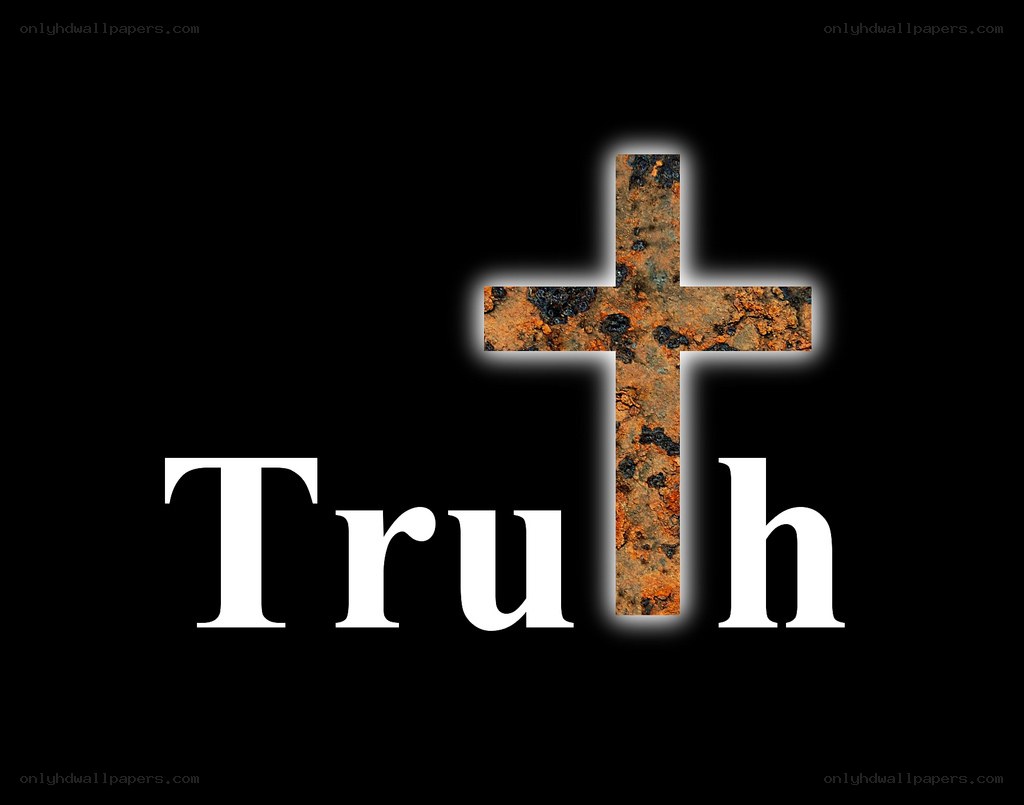 Rusty cross with truth text