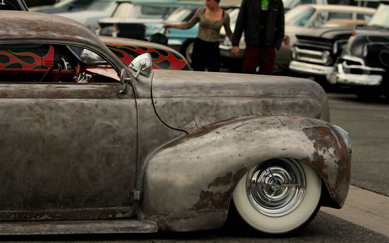 Rusty custom car at a show