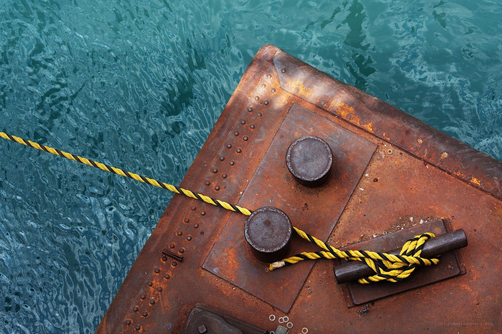 Rusty dock with rope