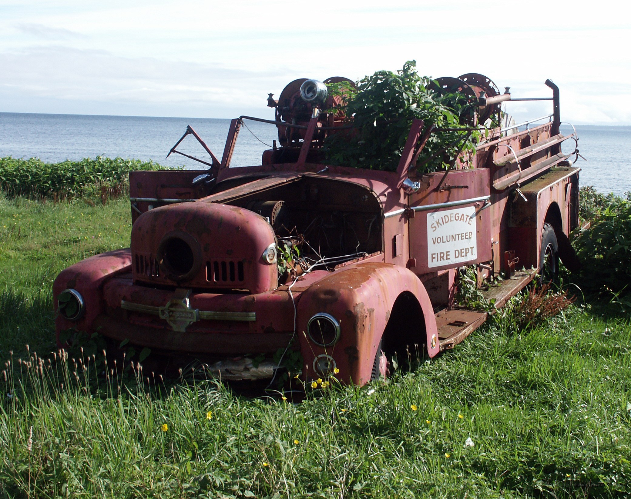 Rusty fire truck by the sea