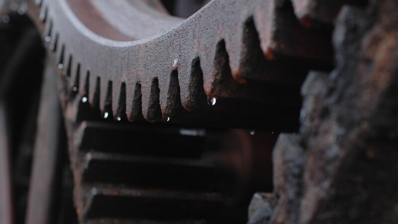 rusty gear with water droplets