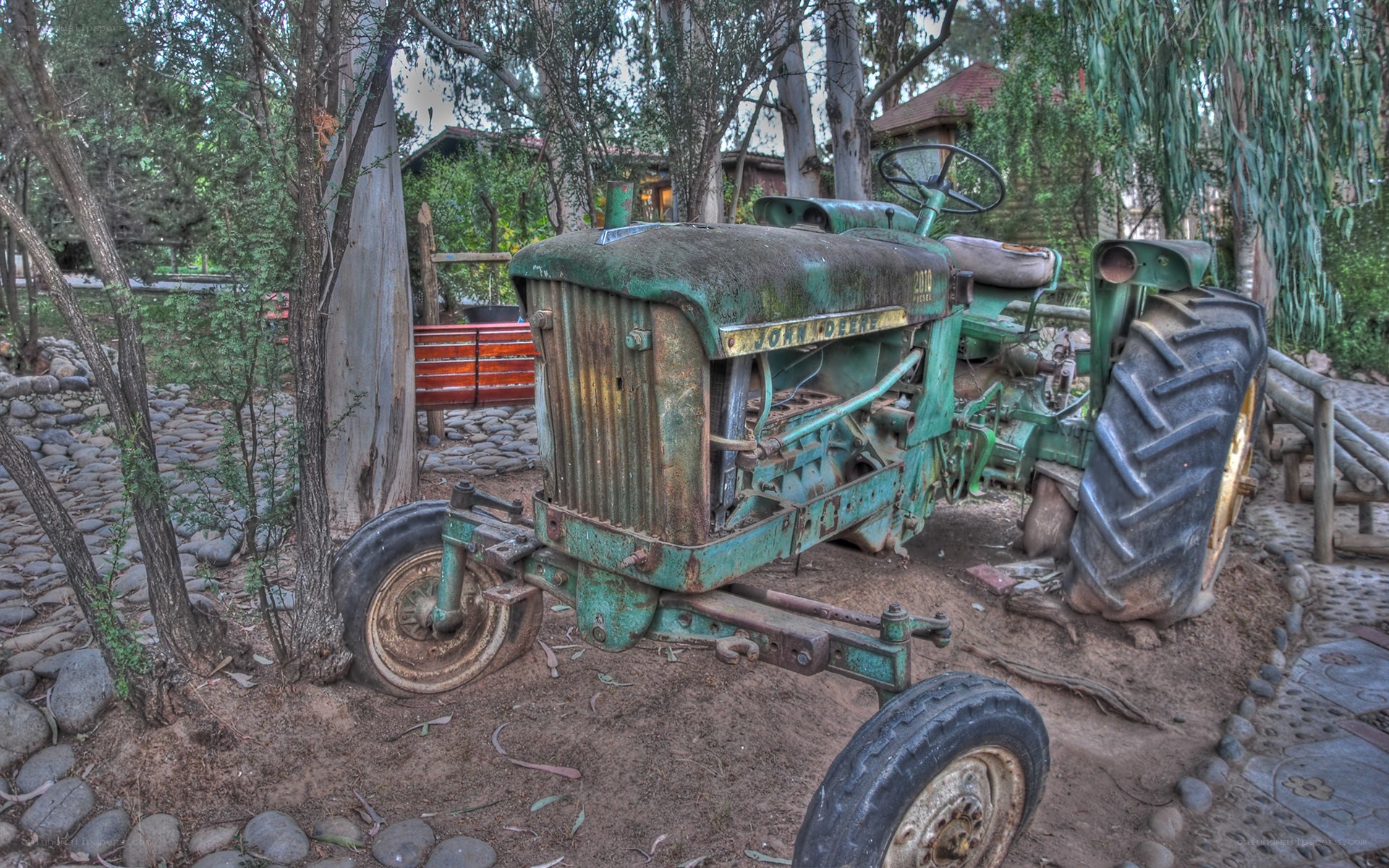 Rusty green tractor in garden
