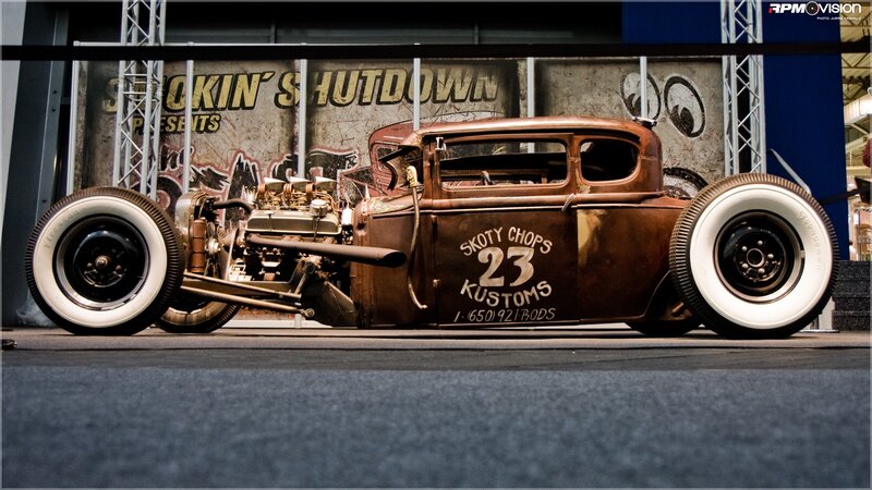 Rusty hot rod car on display