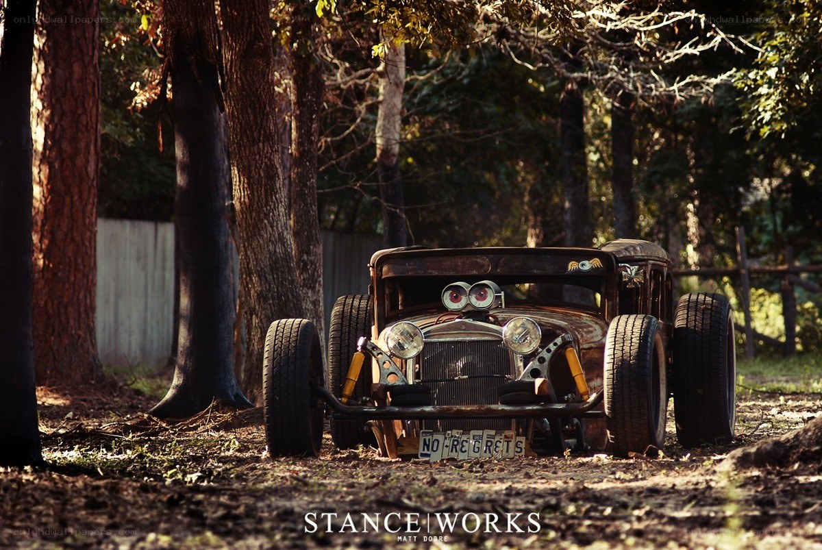 Rusty hot rod in the woods