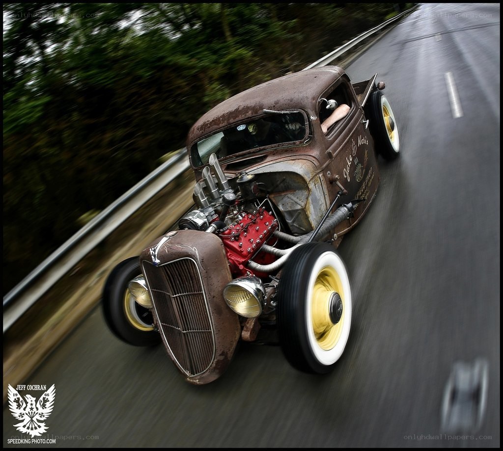 Rusty hot rod on a road