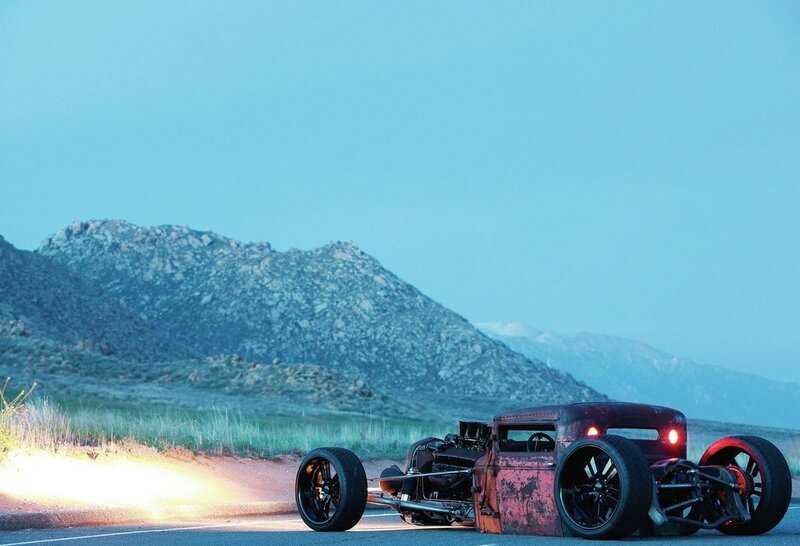 Rusty hot rod on desert road