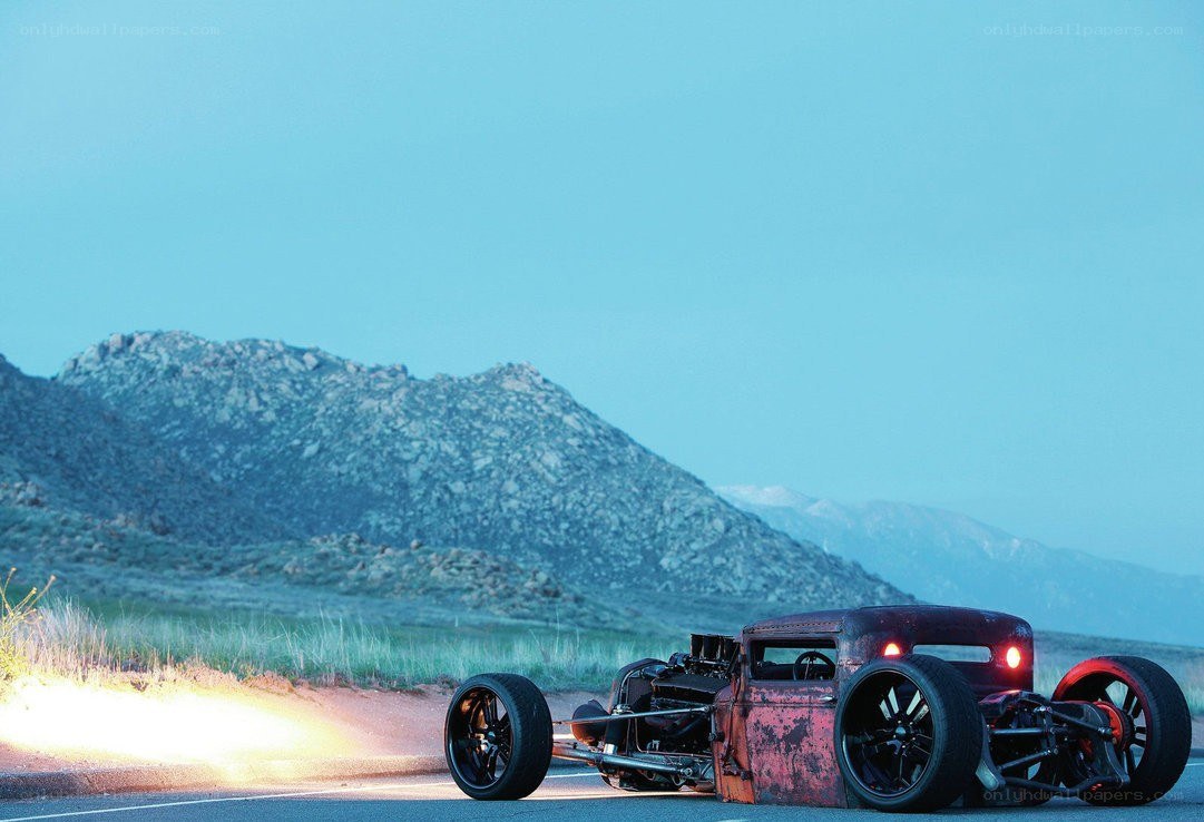 Rusty hot rod on desert road