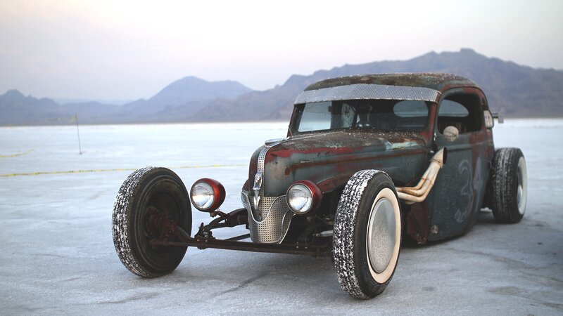 rusty hot rod on salt flat