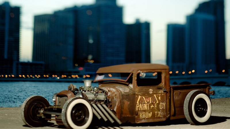 rusty hot rod truck by water