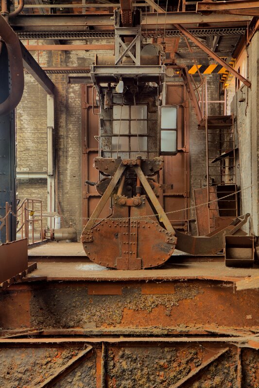 Rusty industrial crane in factory