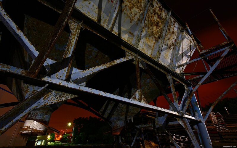 Rusty industrial structure at night