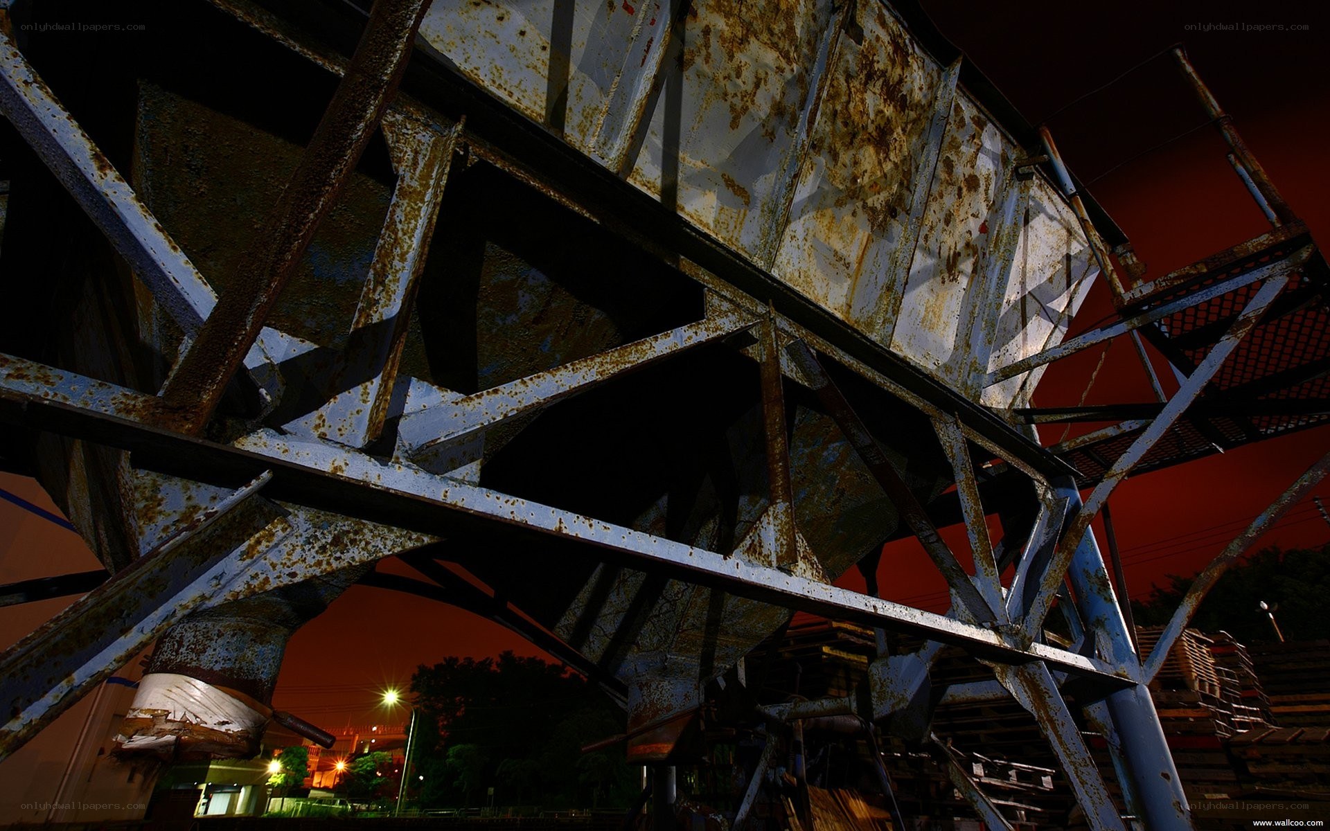 Rusty industrial structure at night