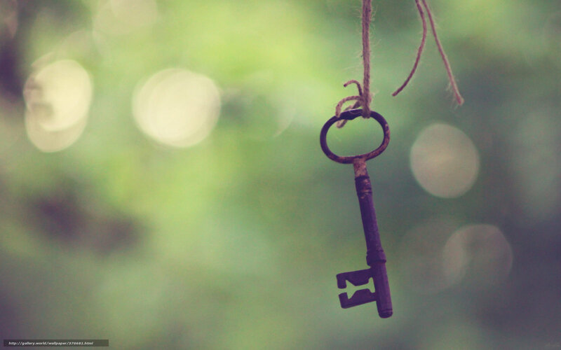 rusty key on string