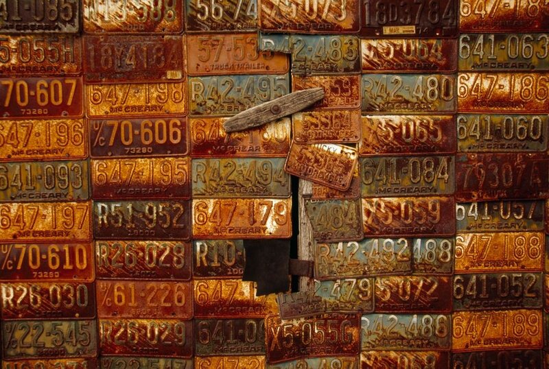 Rusty license plates wall