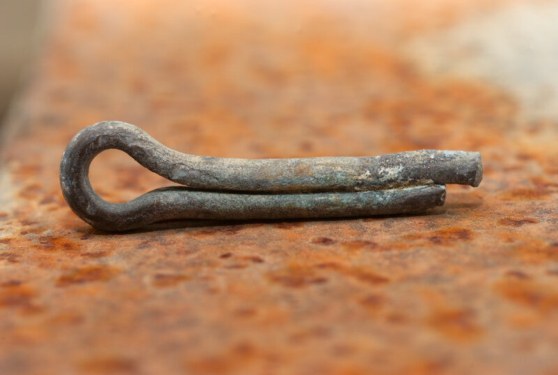 rusty metal fastener on corroded surface