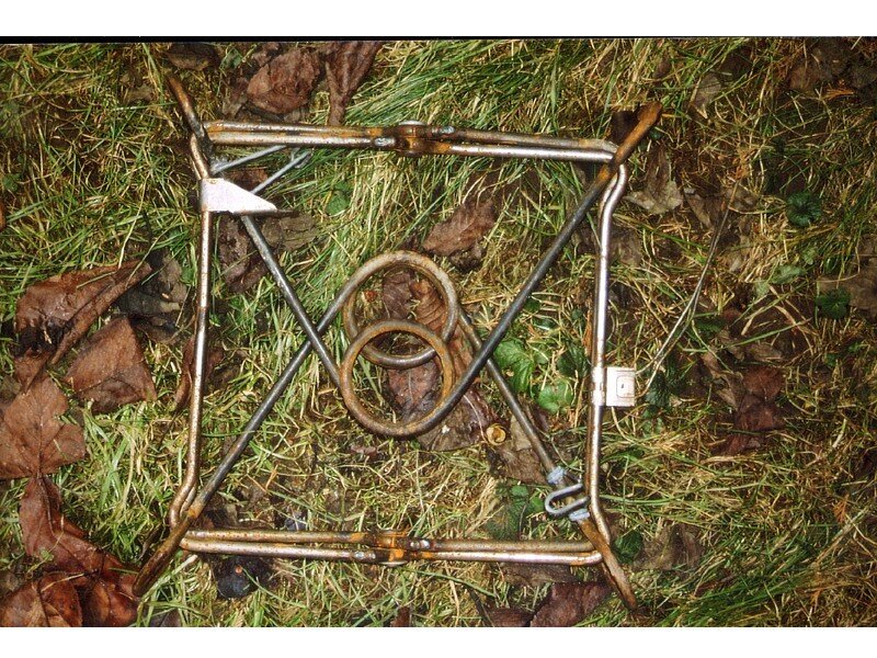 rusty metal frame on grass