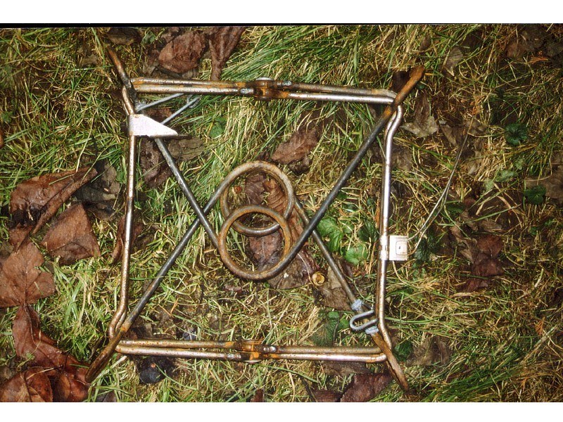 rusty metal frame on grass