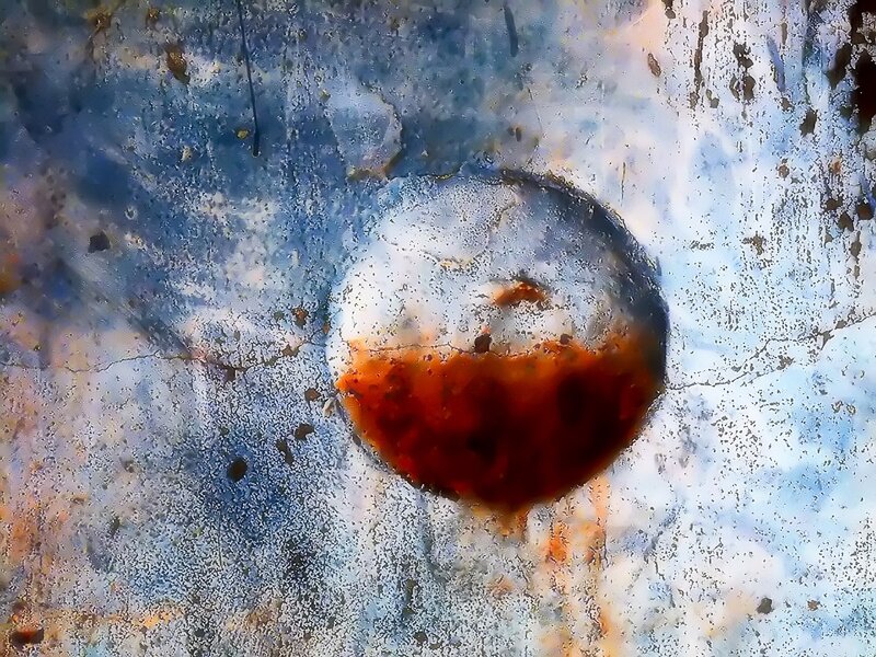 rusty metal surface with circular stain