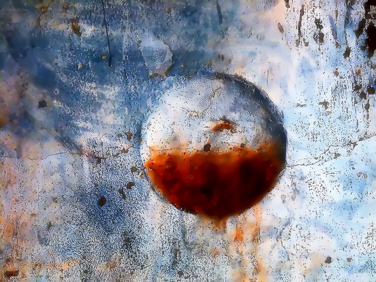 rusty metal surface with circular stain