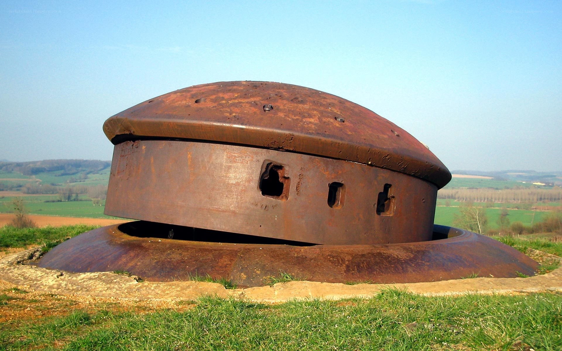 Rusty military bunker in a field
