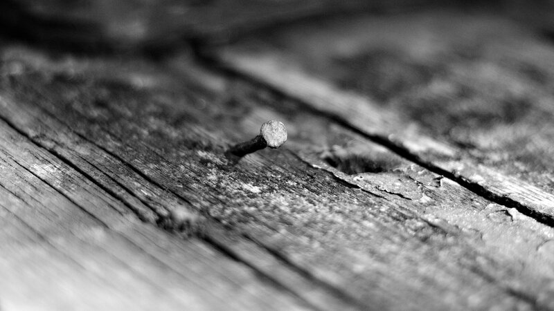 rusty nail in old wood