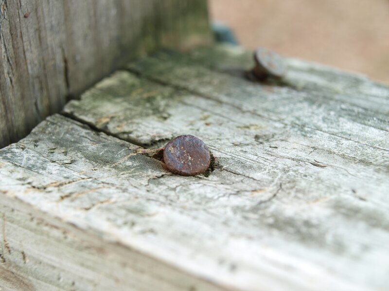 Rusty nail in weathered wood