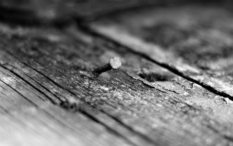 Rusty Nail in Wood — Black